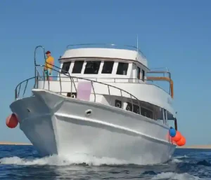 Manolo Tours boat heading to the Dolphin House in Hurghada.