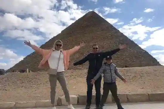 A family posing for a photo during their Cairo day trip from Hurghada.