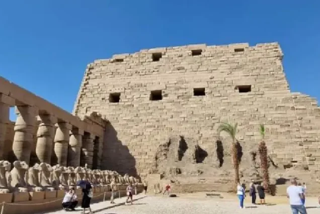 Sacred Lake and Great Scarab statue at Karnak complex.