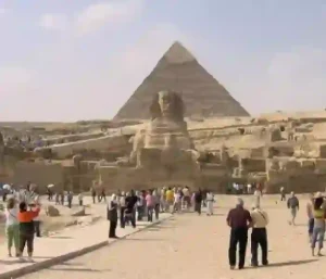 Camel riding at the Giza Pyramids during Cairo minibus trip.