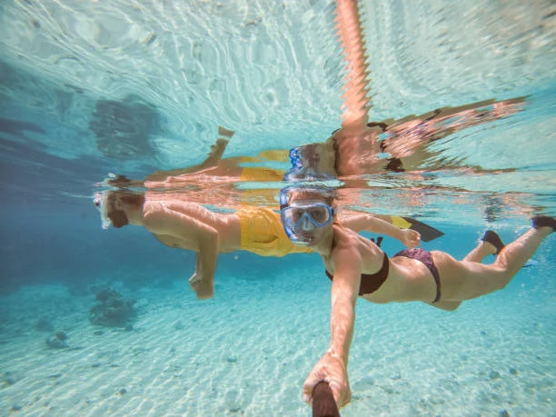 Snorkeling in turquoise waters and coral reefs