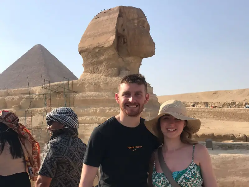 Couple at Giza Pyramids and Sphinx booked through Hurghada private tours